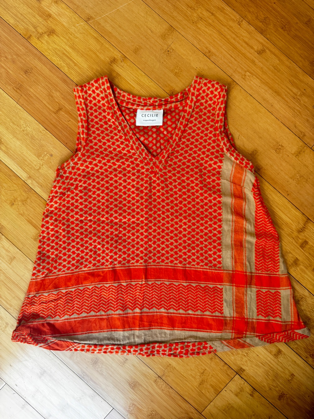 CECILIE Copenhagen top with red and beige woven geometric pattern. 100% cotton